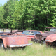 I found a nice hoard of old cars resting in a field. among them a Jeep Jeeepster, and old CJ.
